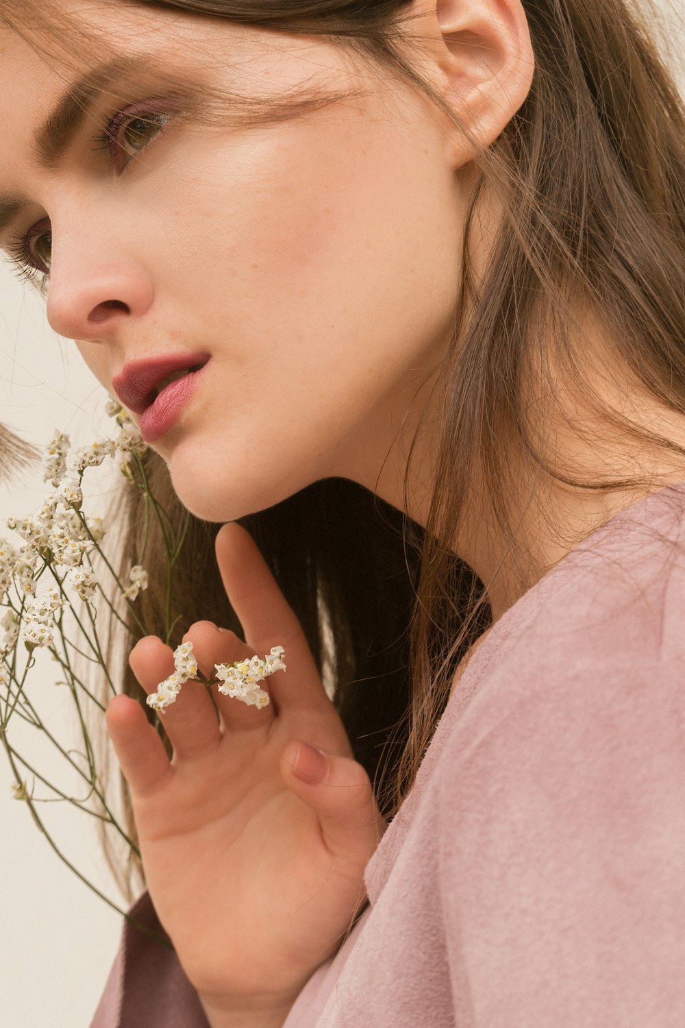 a woman with a flower in her hand