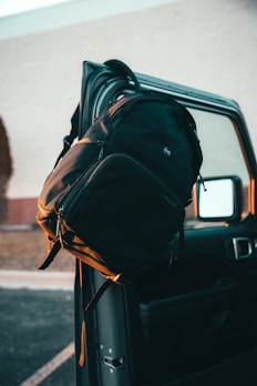 a backpack sitting on the back of a truck