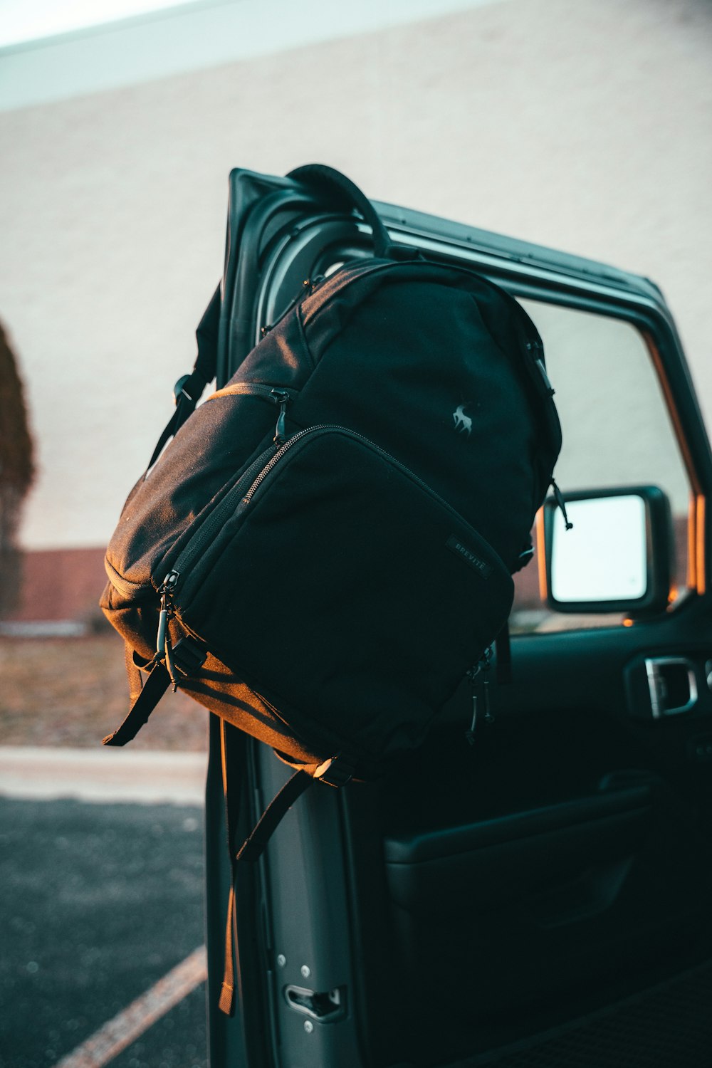 a backpack sitting on the back of a truck