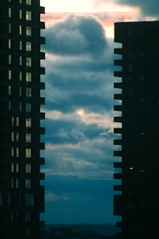 a couple of tall buildings sitting next to each other