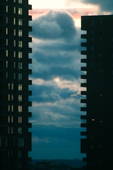 a couple of tall buildings sitting next to each other