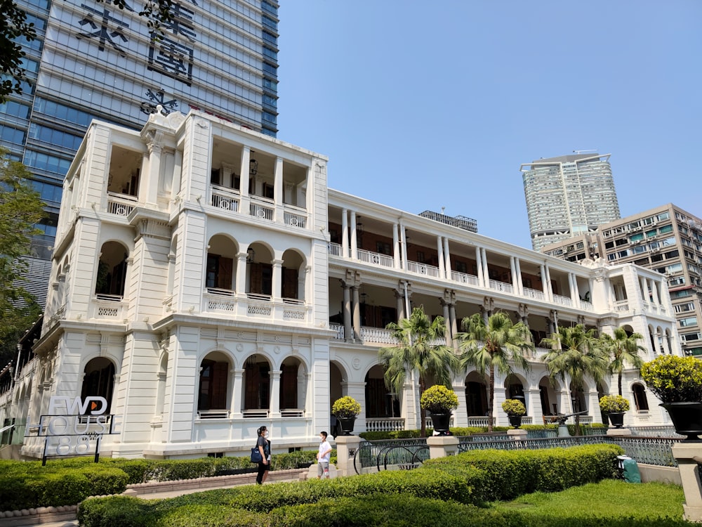 a large white building with many windows and balconies