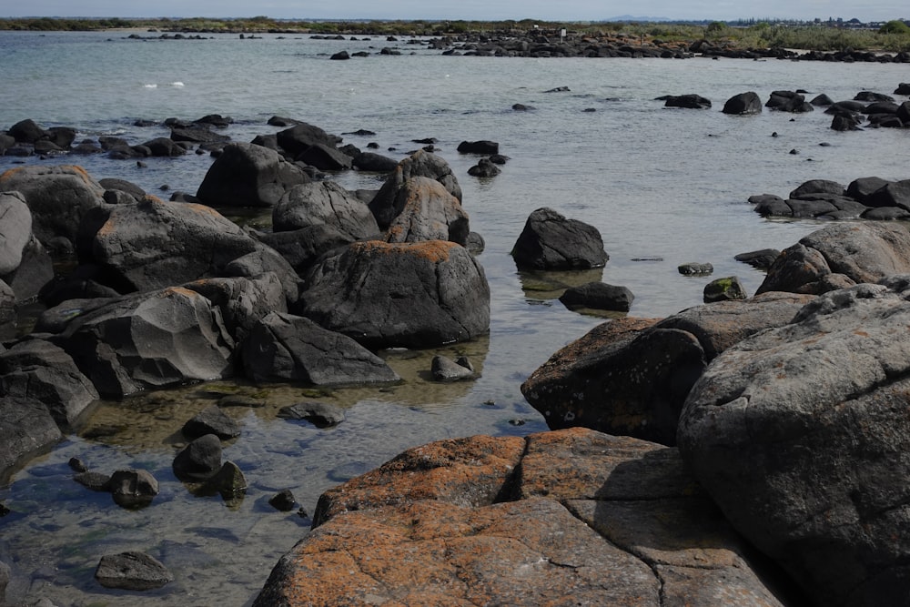 a body of water surrounded by large rocks