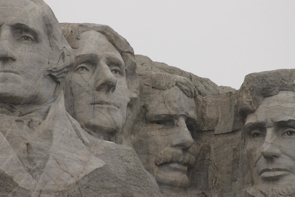 a group of presidents carved into the side of a mountain