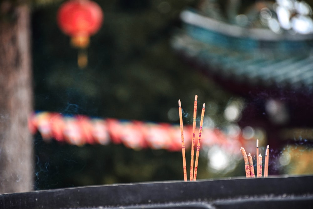 a close up of a bunch of sticks in front of a building