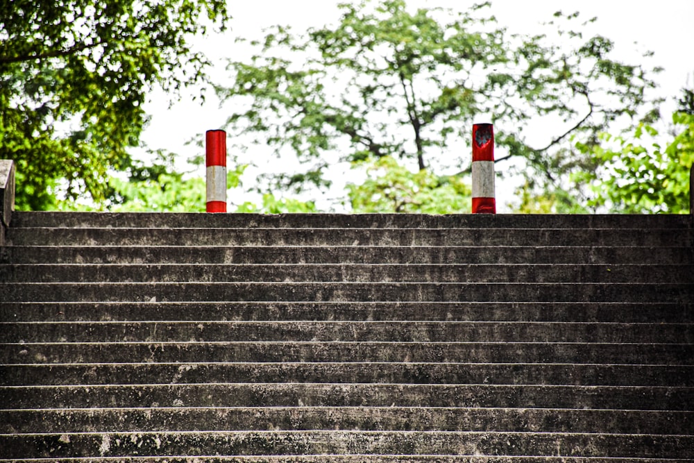a set of stairs with red and white barriers