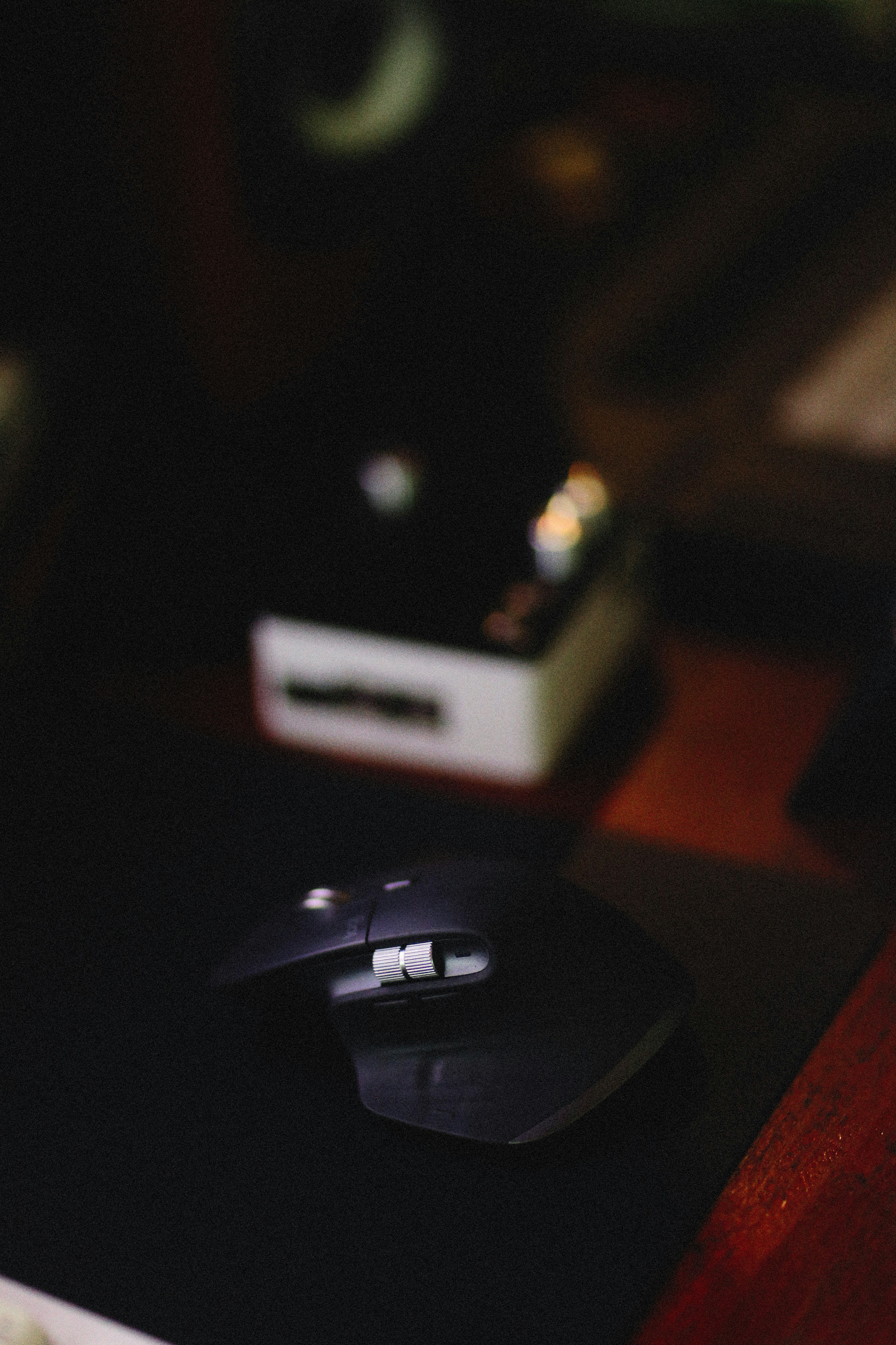 a computer mouse sitting on top of a desk