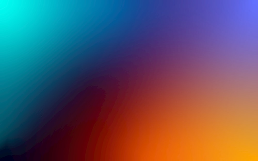 a blurry image of a rainbow colored background