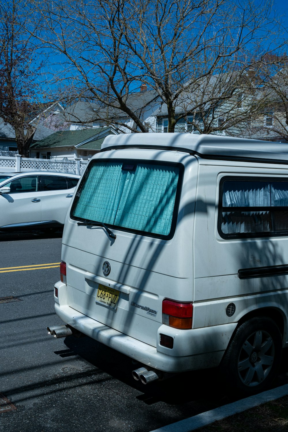 a white van parked on the side of the road
