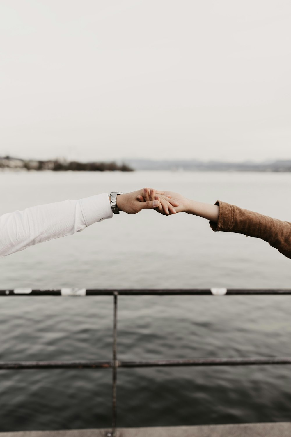 two people reaching out their hands to each other