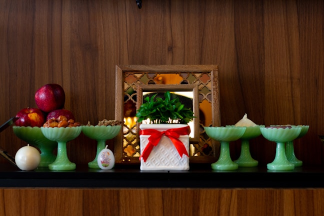 A beautifully arranged display of decorative items on a shelf.