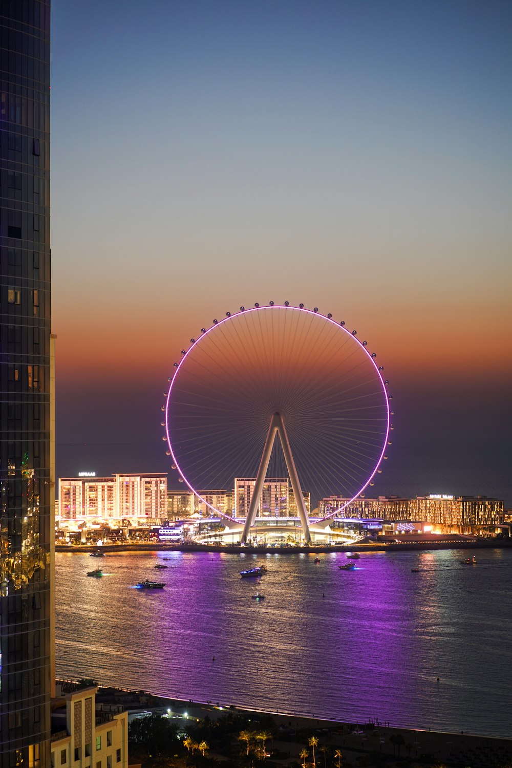 a ferris wheel in the middle of a large body of water