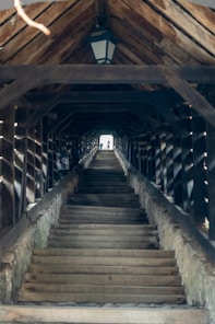 a set of stairs leading up to a covered walkway