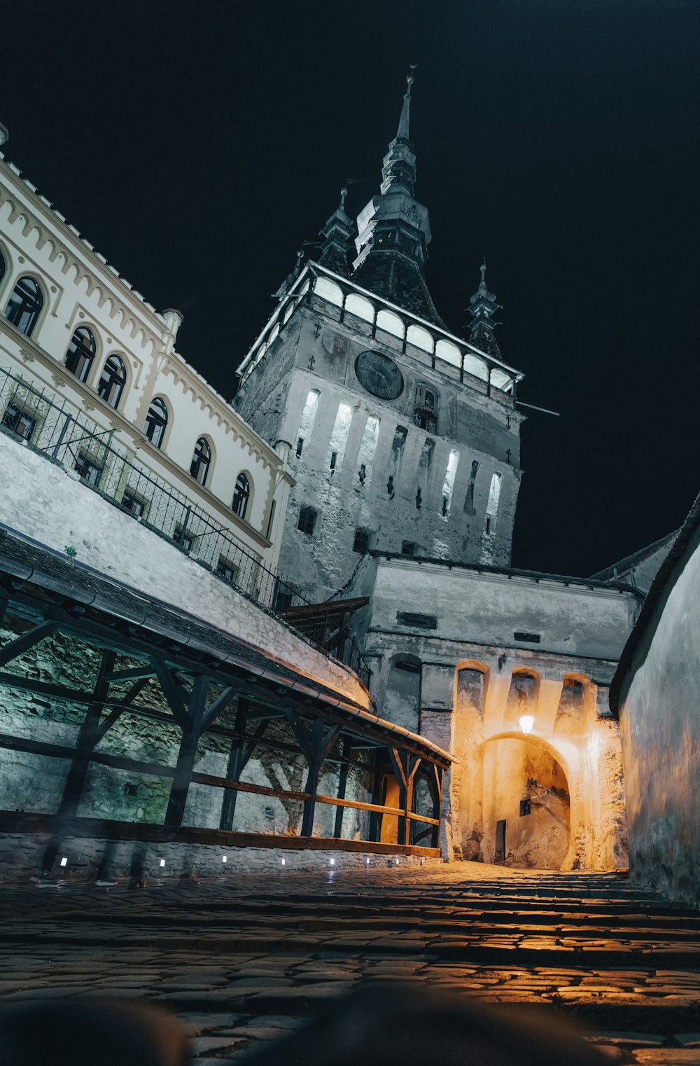 a large building with a clock tower at night