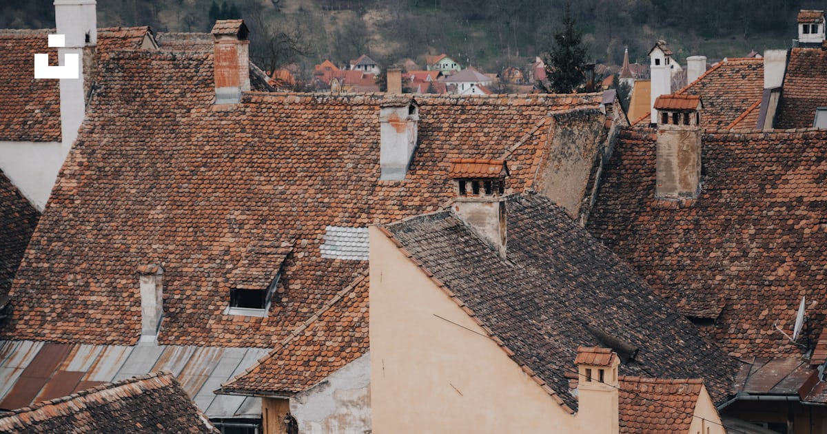 A view of rooftops and buildings in a city photo – Free Romania Image ...