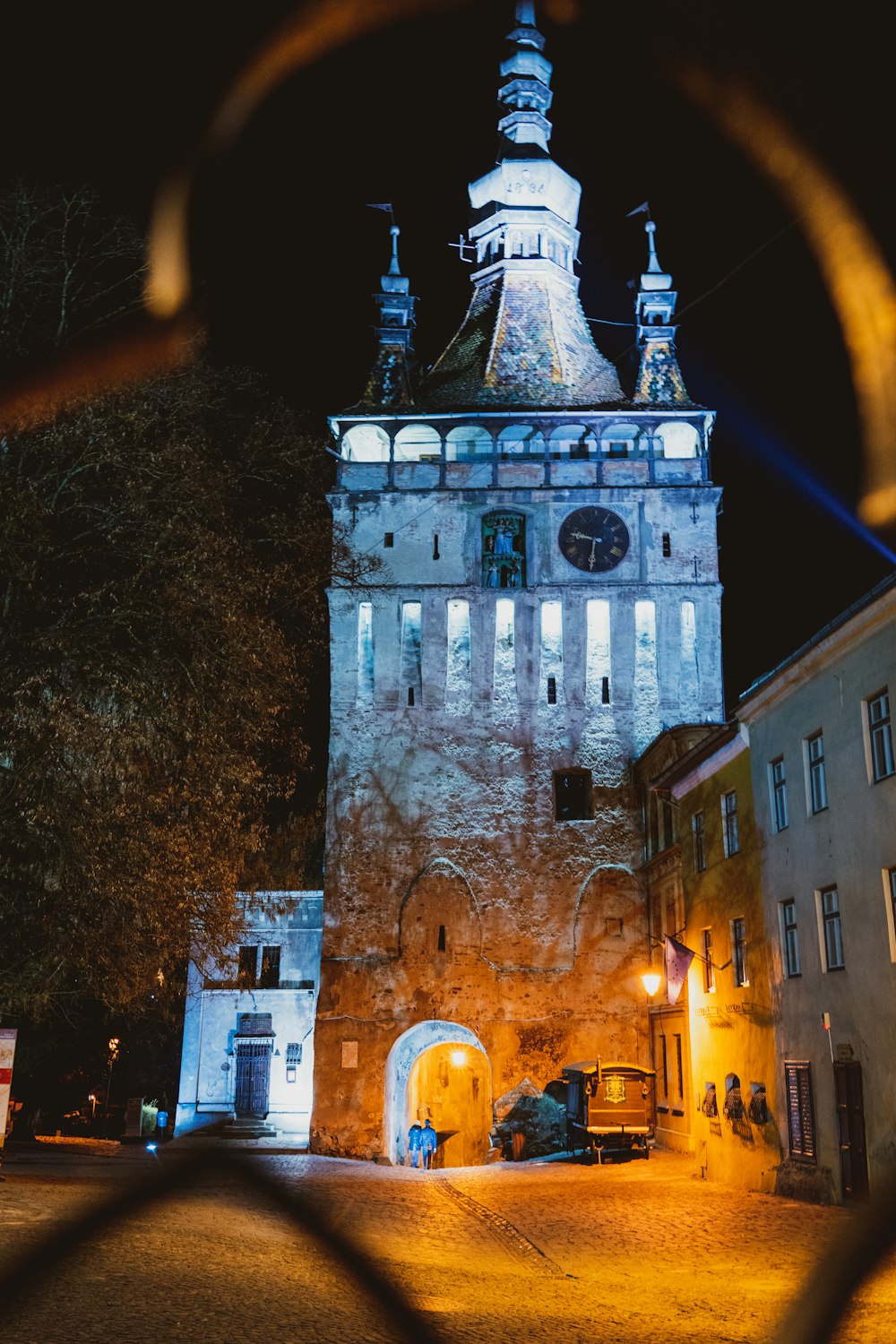 a tall tower with a clock on it's side