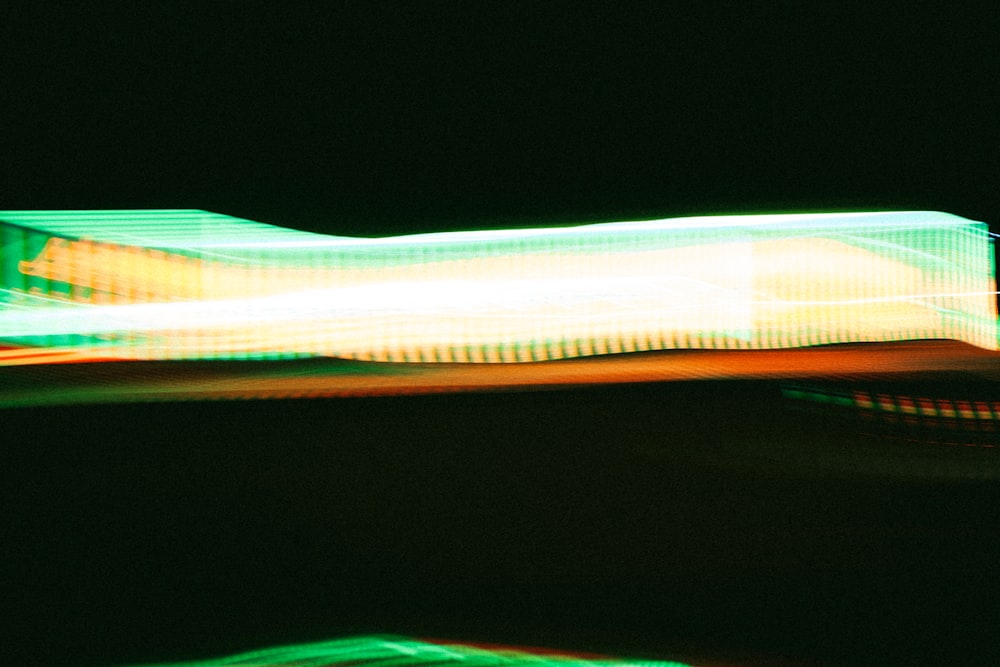 a blurry photo of a street light at night