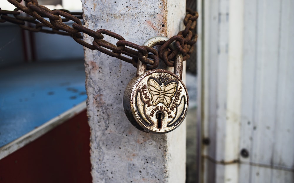 a close up of a padlock on a chain