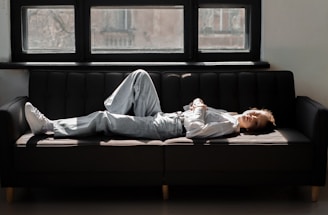 A person relaxing on a comfortable pillow in a sunlit room.