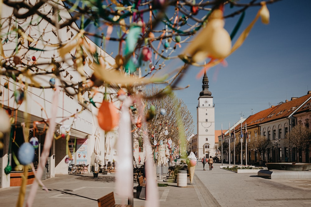 a city street with a clock tower in the background