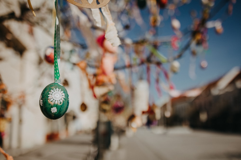 a street scene with focus on a green ornament