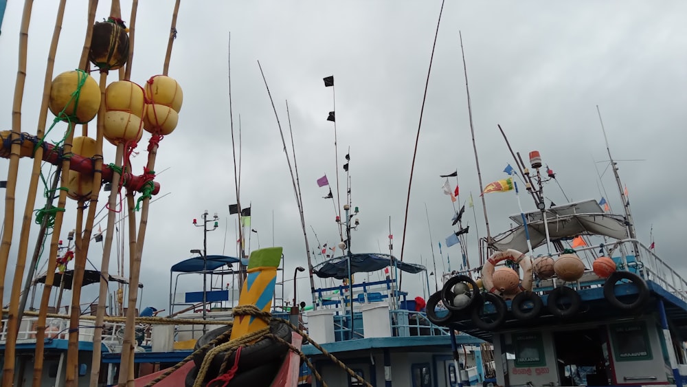 a group of boats sitting next to each other on a body of water