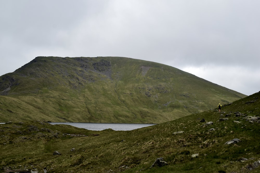 a mountain with a lake in the middle of it