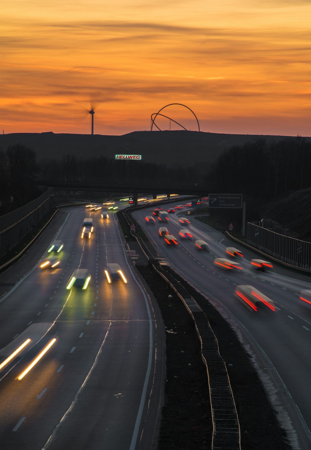 a highway filled with lots of traffic at night