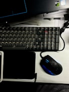 Professional desk setup featuring a foldable Android device in desktop mode alongside a mechanical keyboard.