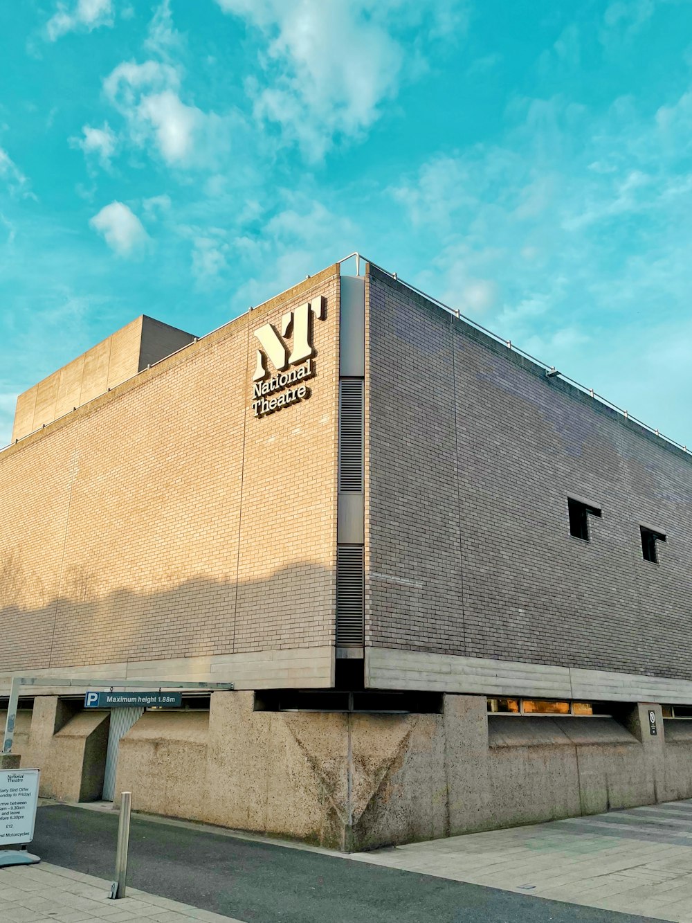 a large brick building with a sky background