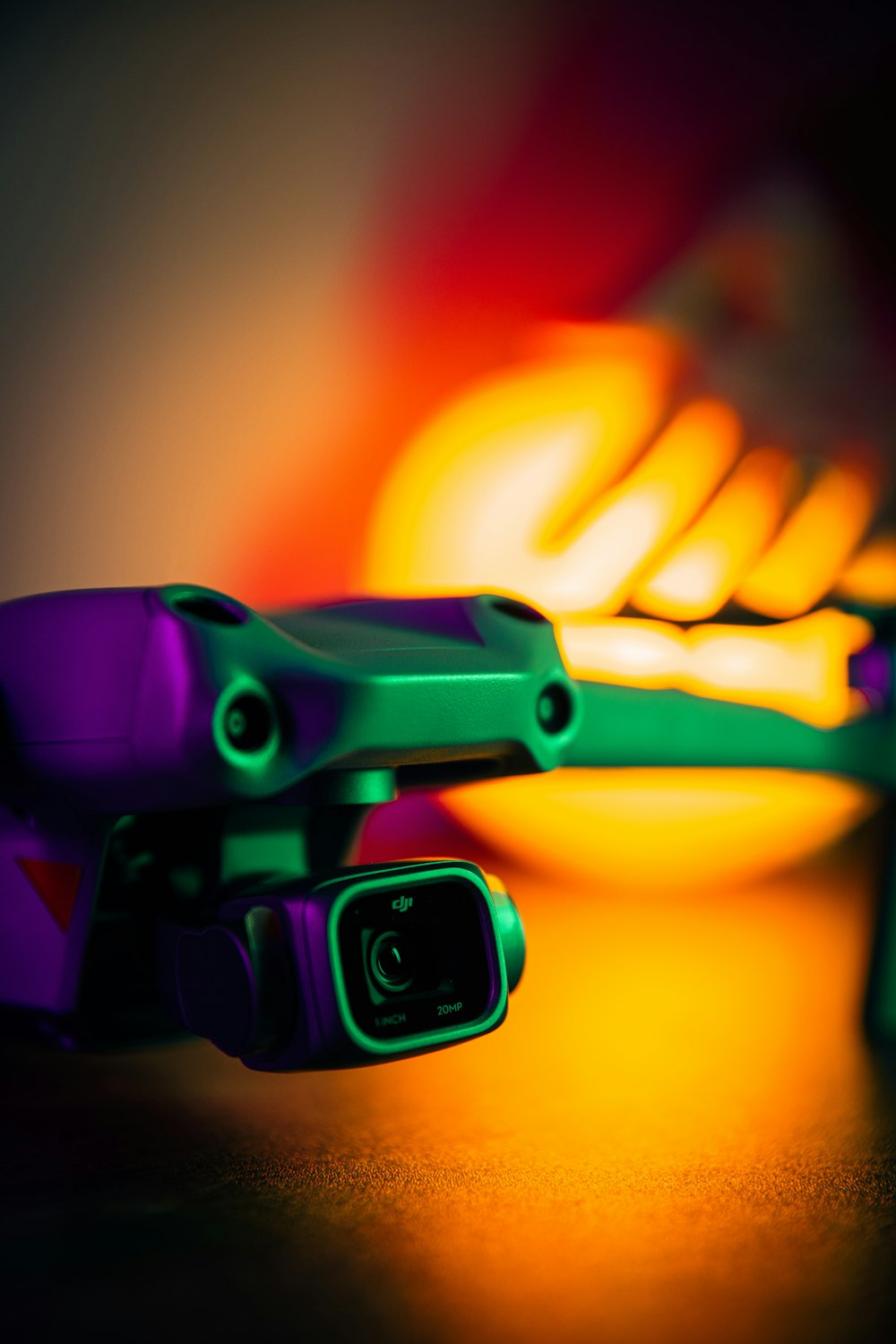 a close up of a pair of green and purple skateboards