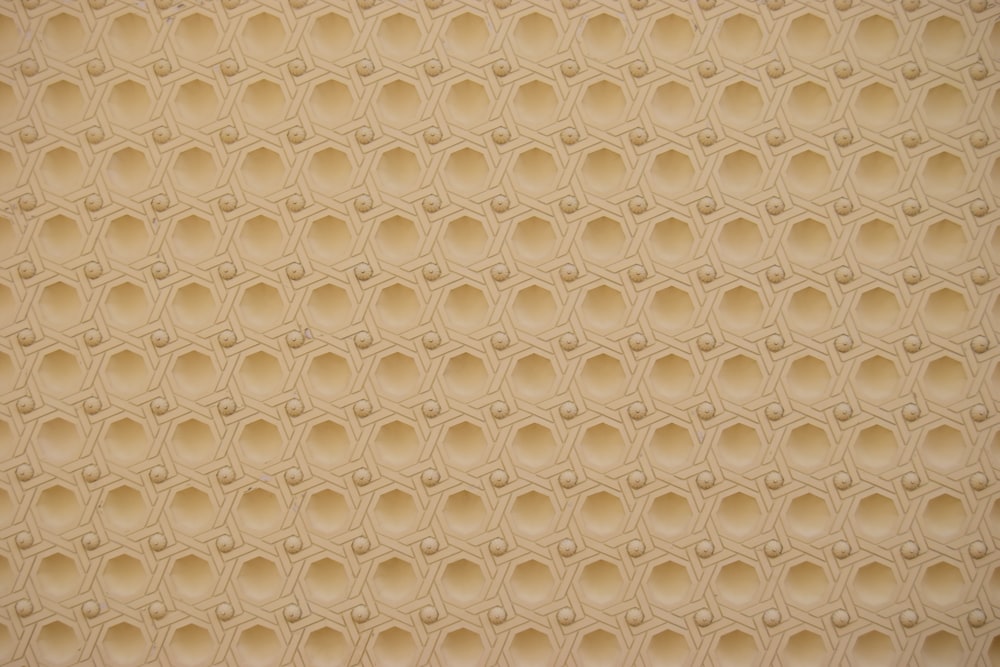 a close up of a wall with a pattern on it