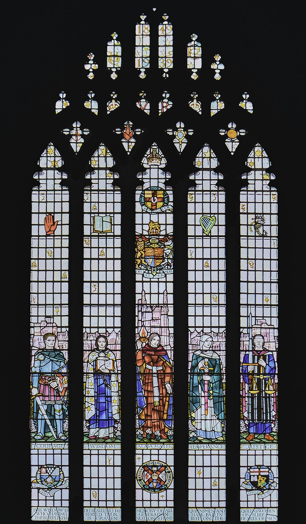 a large stained glass window in a church