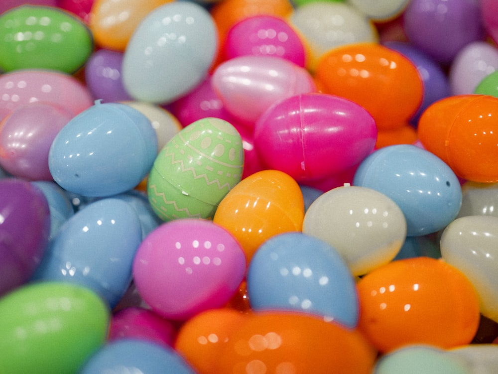 a pile of colorful eggs sitting on top of each other