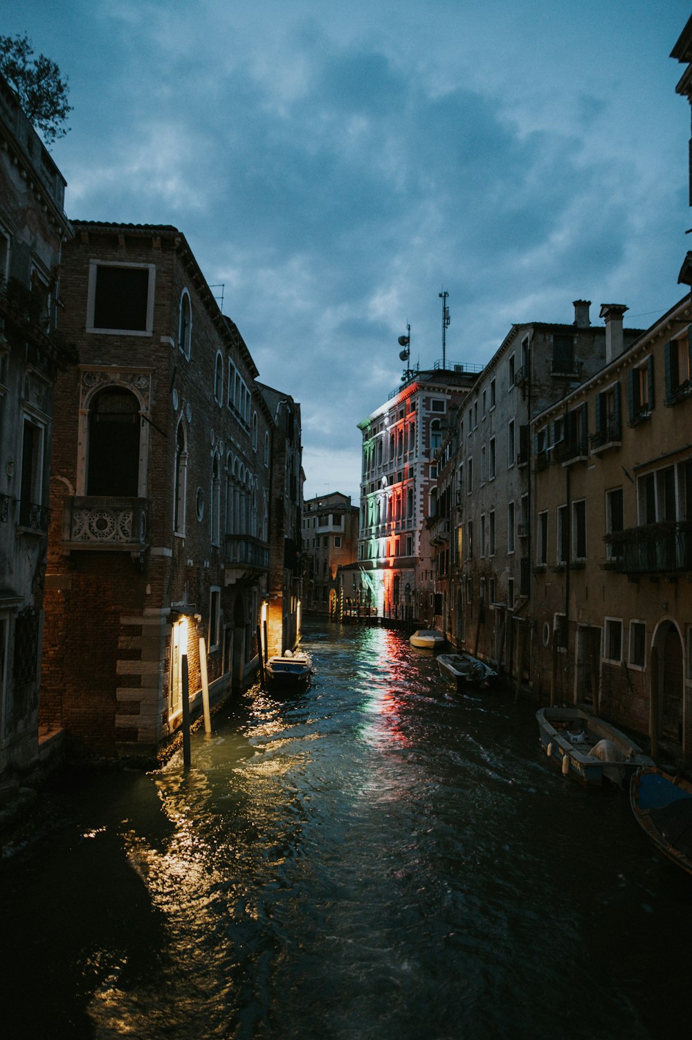 a river running through a city next to tall buildings