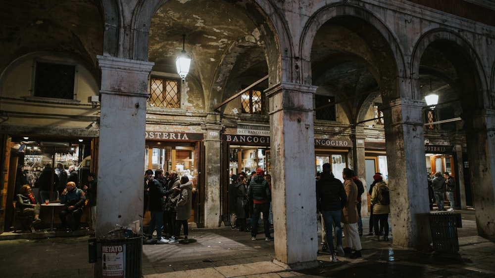 a group of people standing outside of a building