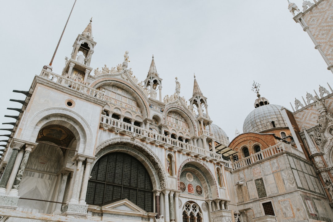 a large white building with a clock on it