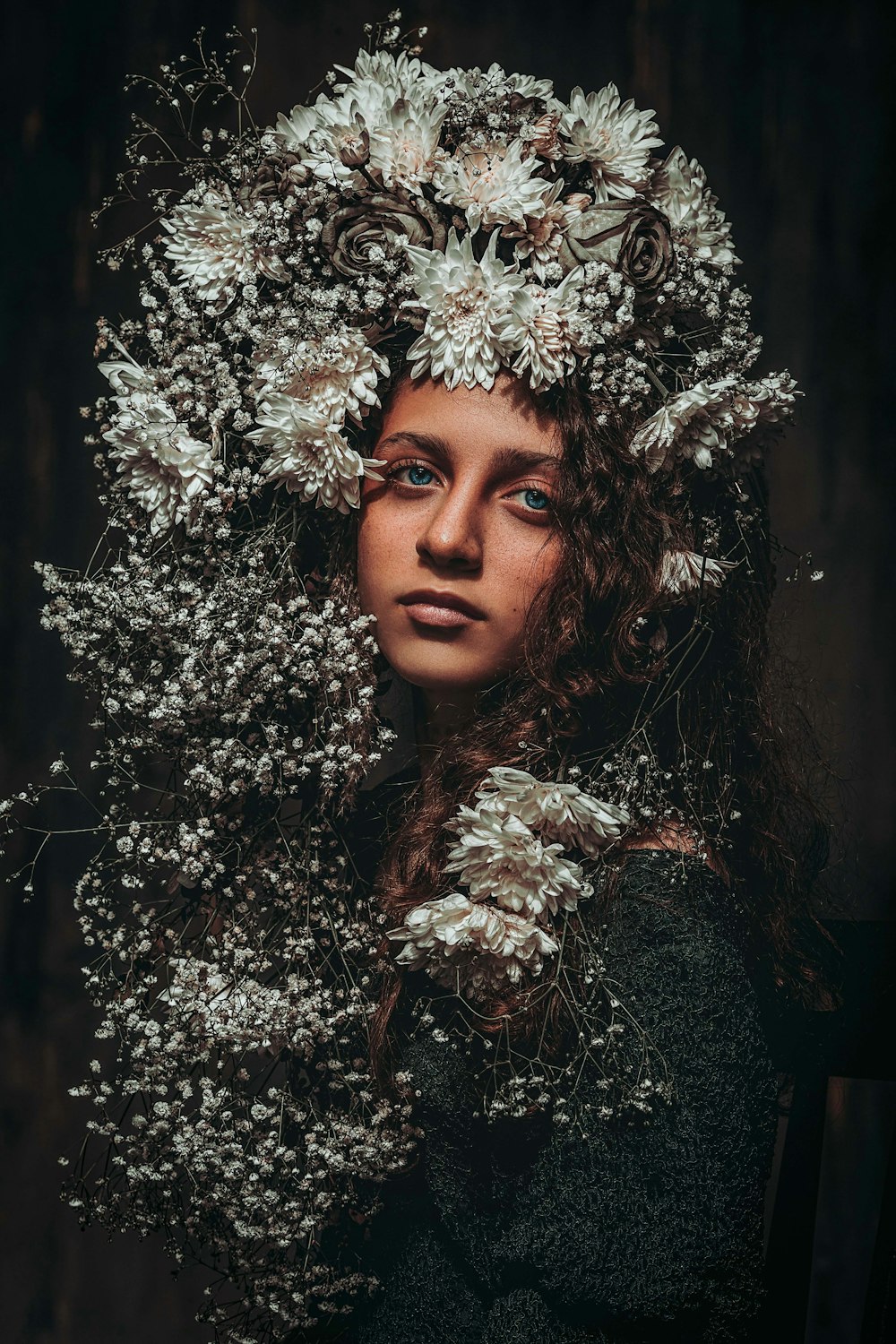 a woman with flowers in her hair