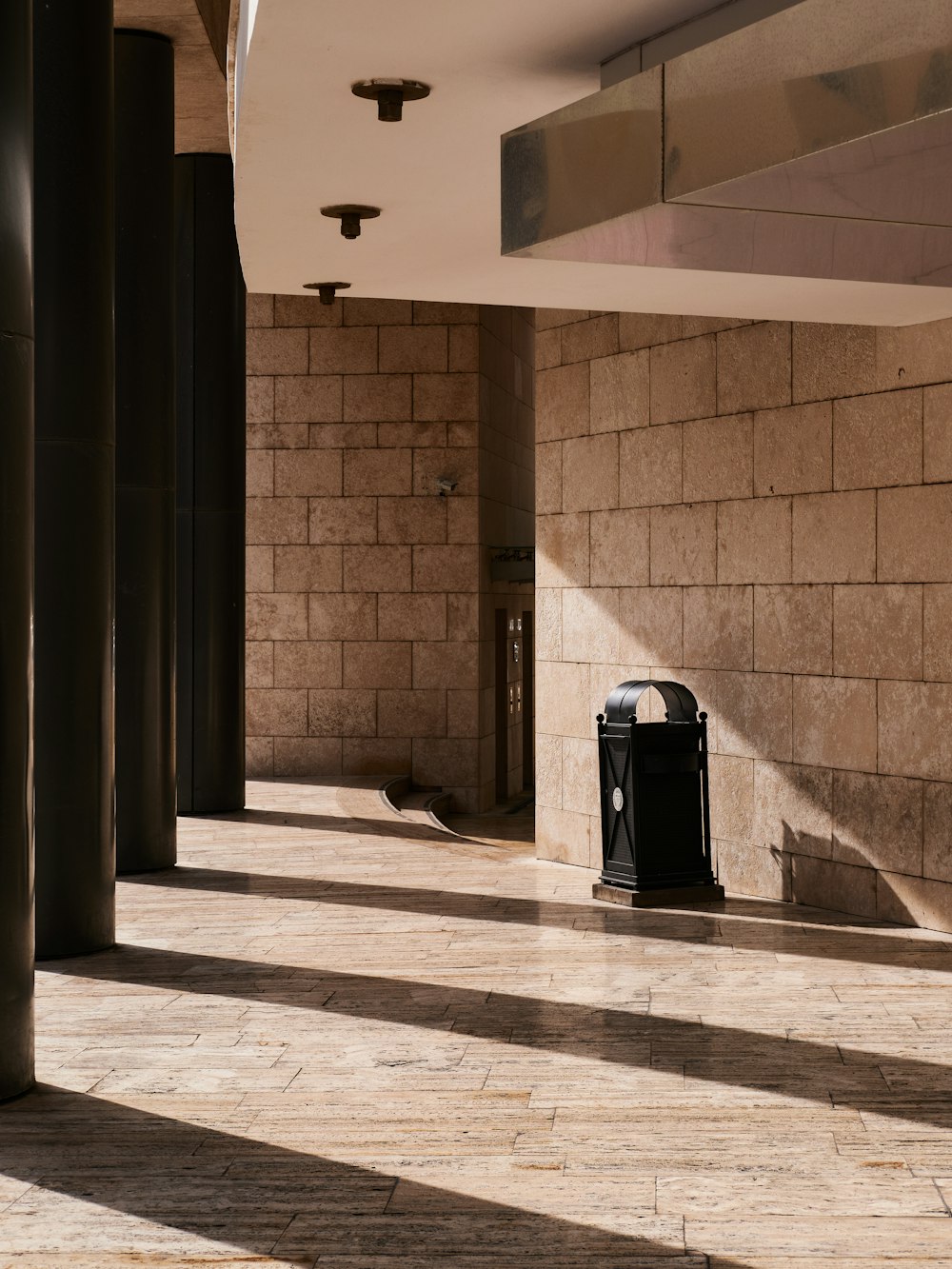 a black suitcase sitting on a tiled floor