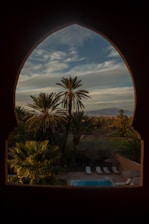 A scenic view of the hotel gardens and pool area.