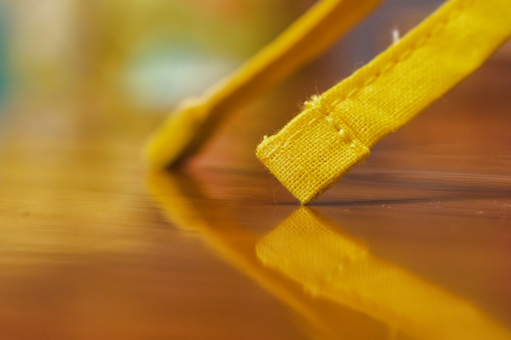 a close up of a yellow object on a table