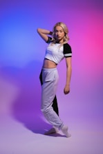 A vibrant photo of a woman confidently jogging in a matching sportswear set from Xianwei Clothing.