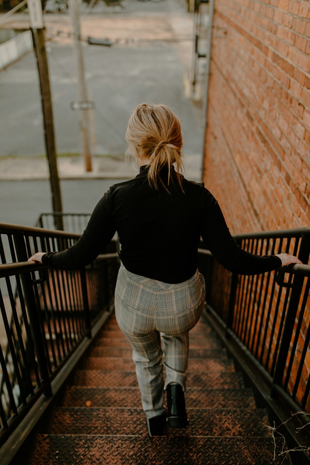 a woman walking down a flight of stairs