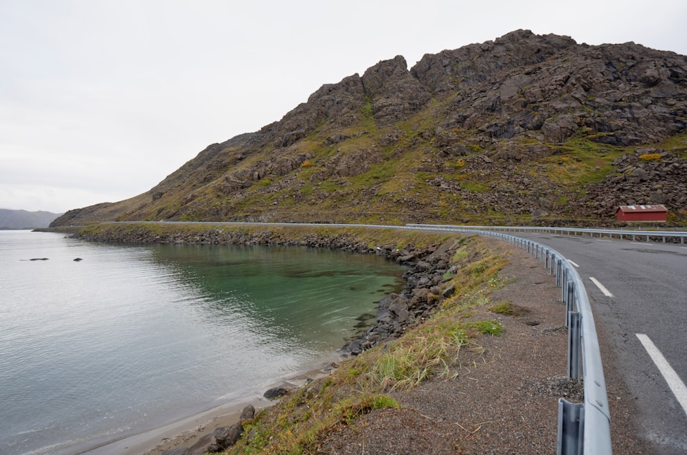 a road next to a large body of water