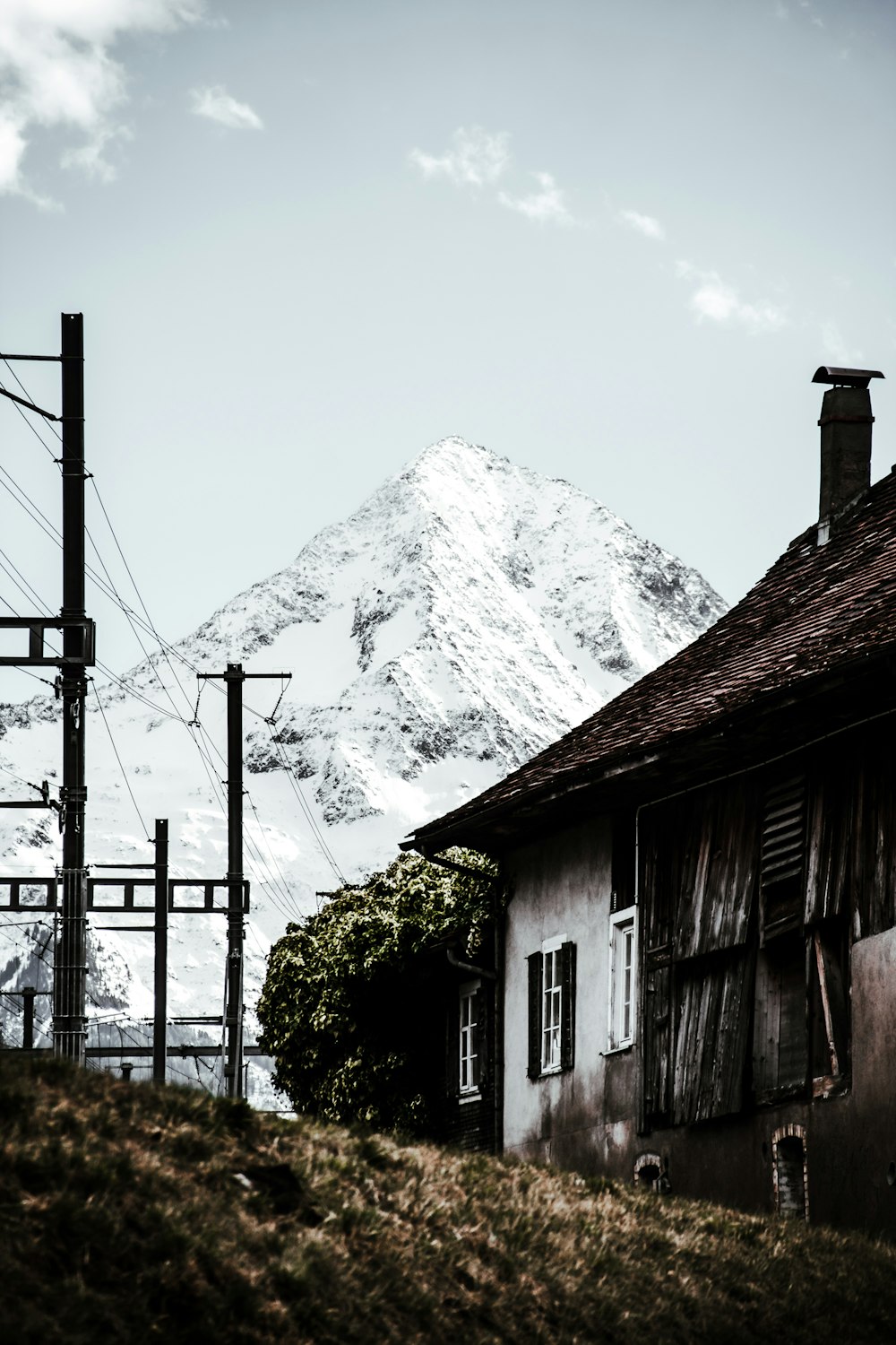 a house with a mountain in the background