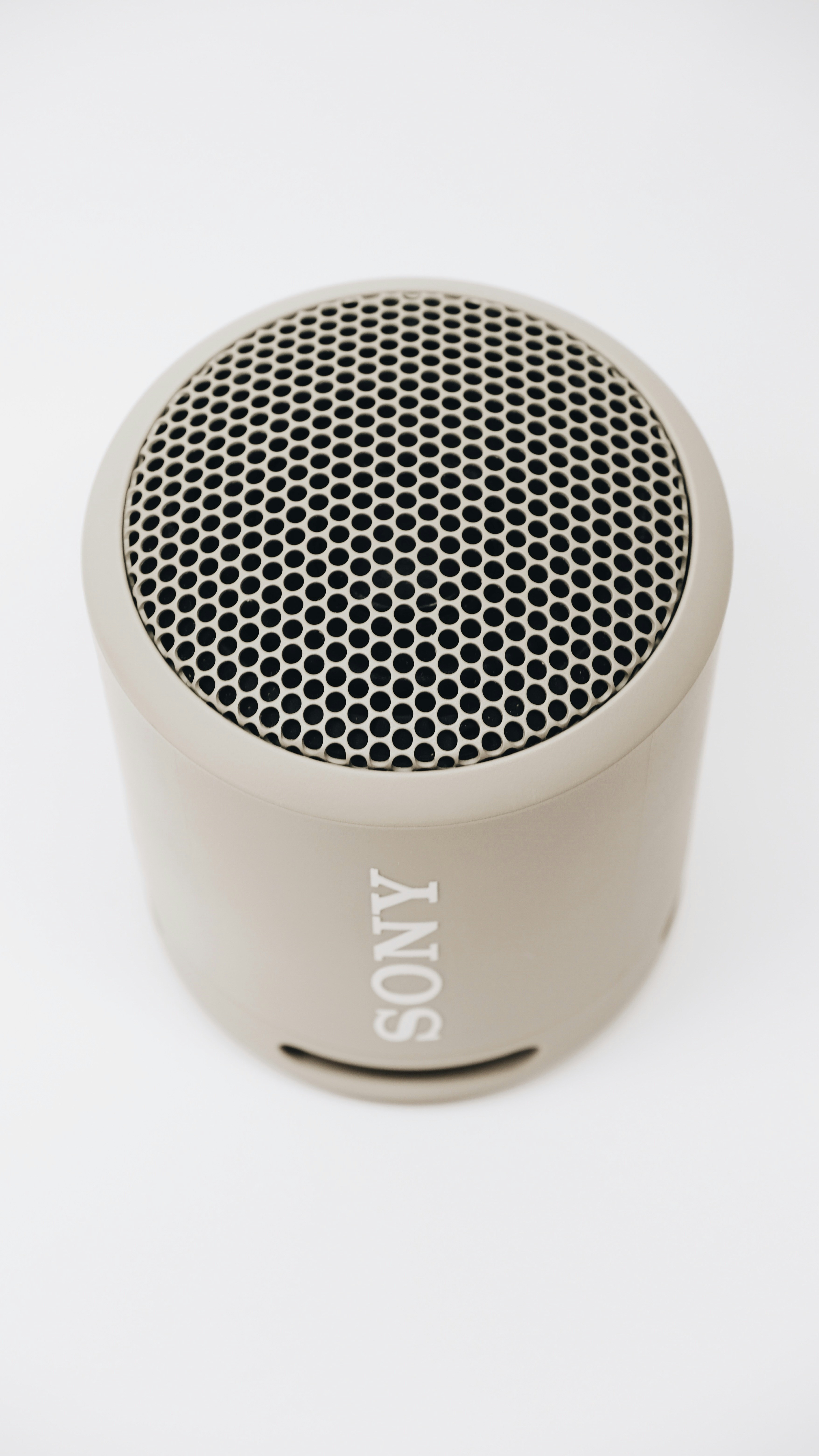 a close up of a speaker on a white surface