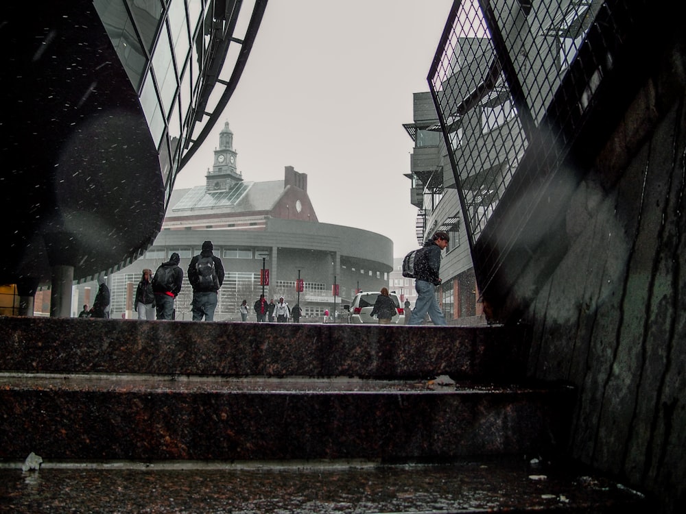 a group of people walking up some steps