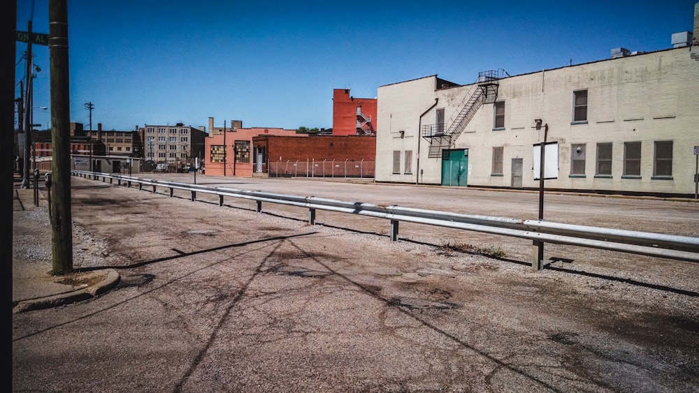 an empty street with a fire hydrant in the middle of it