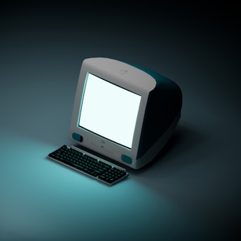 a computer with a white screen sitting on a table