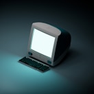 a computer with a white screen sitting on a table